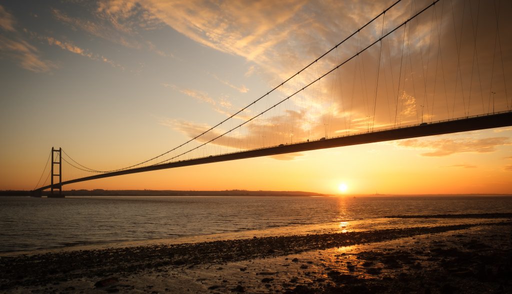 Sun setting below the Humber Bridge, East Riding of Yorkshire