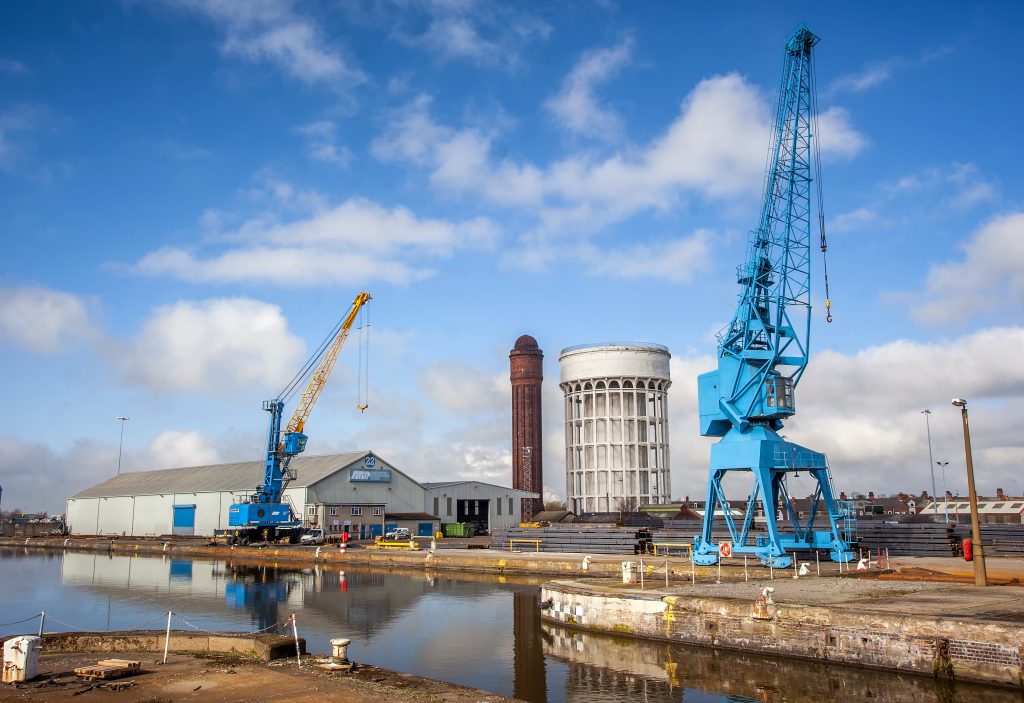 A photo of Goole docks with cranes and water towers
